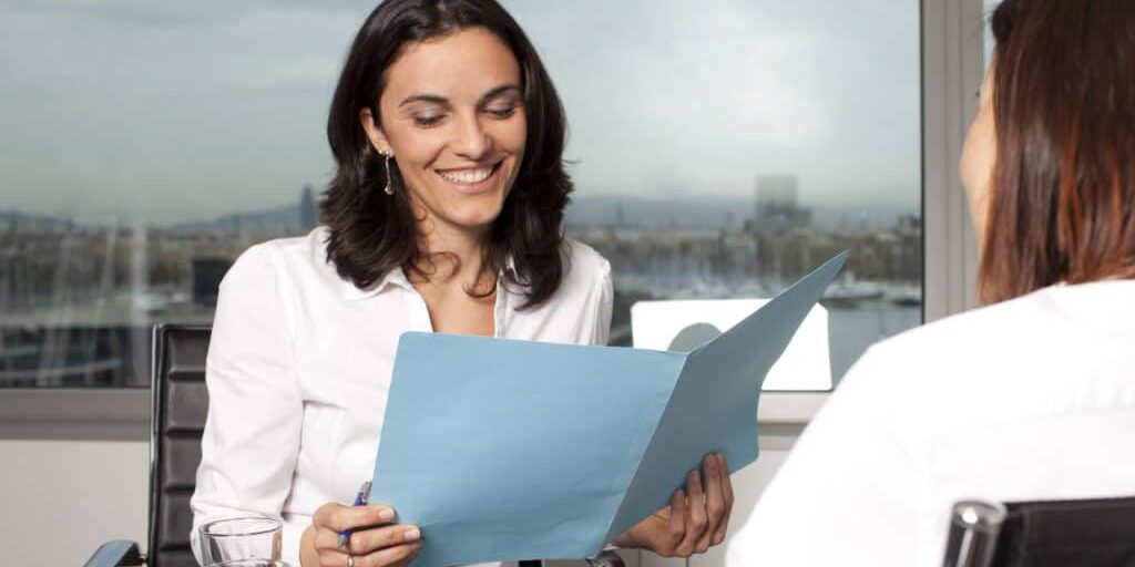 Recruiter checking the CV during job interview